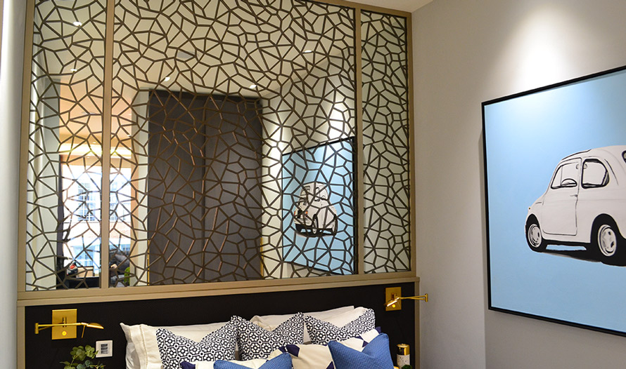 Decorative laser cut bronze screens in bedroom wall mirror