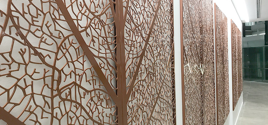 Decorative wall panels in copper leaf design