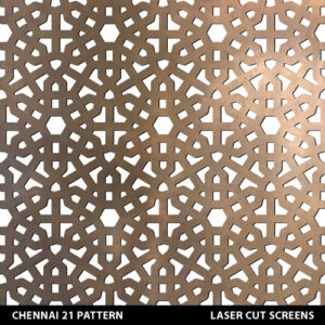 Moroccan laser cut fretwork design patterns in gold colour on white wall