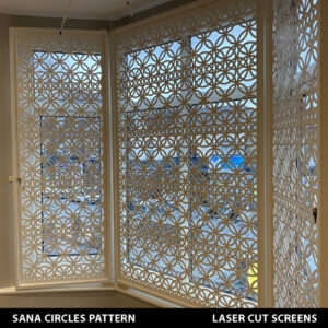 White bifold security window shutters in laser cut pattern