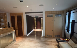 Before shot showing decorative air conditioning laser cut screens One Hyde Park to cover doors in hotel spa