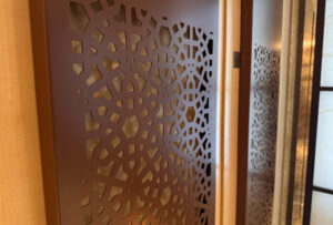 Decorative air conditioning laser cut screens One Hyde Park to cover doors in hotel spa
