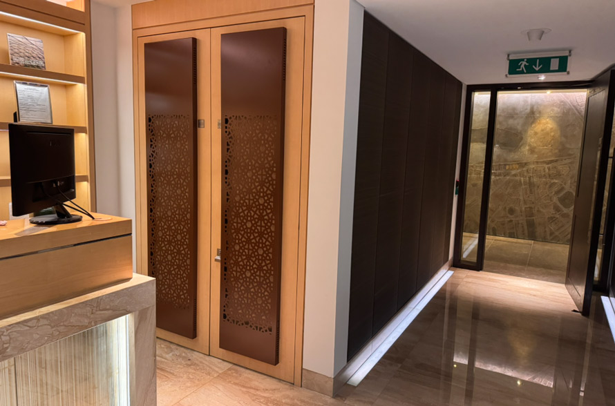 Decorative air conditioning screens One Hyde Park to cover doors in hotel spa